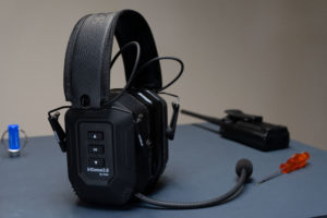 IWCS headset on a table with tools